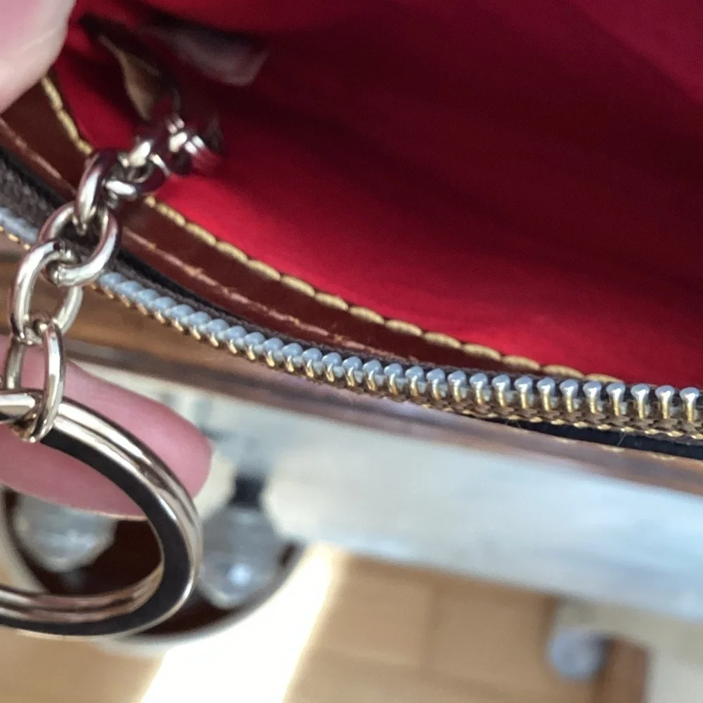 Dooney & Bourke pebbled deep purple and Brown Leather Wristlet, keychain